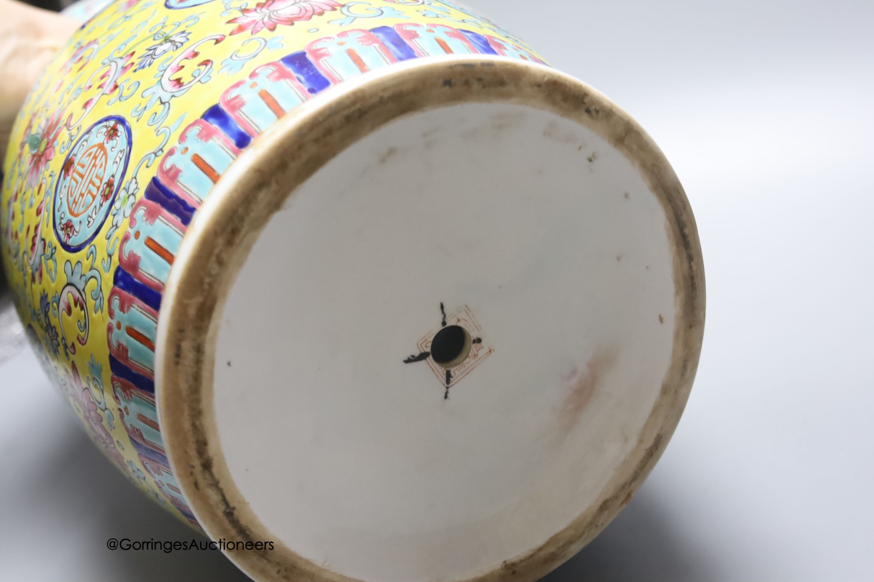 A Chinese yellow ground vase and another painted with chrysanthemums, tallest 46cm